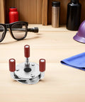 Pro Grade Hella Rugged Stainless Steel Smoke Transducer Removal Tool With Heavy Duty Grippers on workspace with tools, 5-inch size.