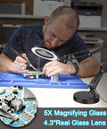Person using All In One Lighted Magnifier With Stand And Clamp For Close Work, 5X Magnification, on electronics
