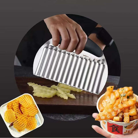 Stainless steel crinkle cutter with black handle slicing potatoes into crinkle-cut fries (front view).