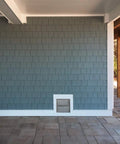 Get Smart Vent Flood Vents Model 1540-521 For Your Foundation installed in a gray shingle wall for hydrostatic pressure relief.