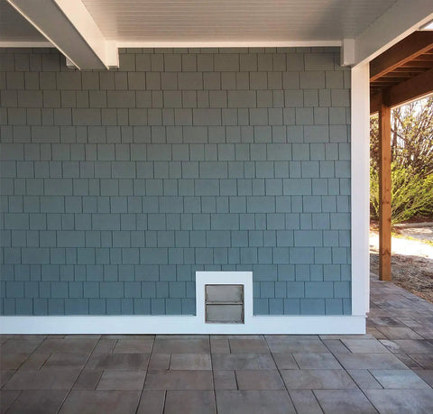 Get Smart Vent Flood Vents Model 1540-521 For Your Foundation installed in a gray shingle wall for hydrostatic pressure relief.