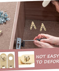 Copper Pivot Hidden Door Hinges 4 Piece Set For Cabinets And Bookcases installed in wooden cabinet, close-up view.