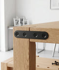 Built Tough Black Stainless Steel Mending Plates With Full Screw Kit installed on wooden furniture corner for reinforcement.
