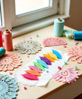 Nine Colorful Plastic Tatting Shuttles Set for Lace DIY Hand Lacemaking Craft on desk with lace doilies and threads.