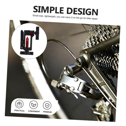 Close-up of Hydraulic Hose Fitting Insert Tool For Bicycles With Needle Driver and bike drivetrain for clean installation.