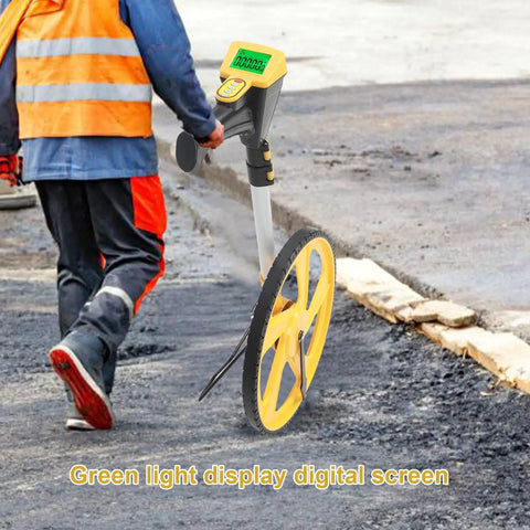 Roll Out Precision Digital Measuring Wheel With Bright Backlit LCD Display And Telescoping Handle on job site with asphalt background.