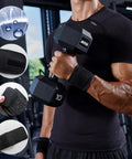 Man lifting dumbbell wearing 2 Pack Adjustable Wrist Brace Set for Fitness and Weightlifting, breathable and elastic material.