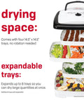 Square Electric Food Dehydrator With Four Stackable Trays And Even Heat Drying For Beef Jerky Fruit Veggies And Homemade Snacks showcasing stacked trays with dried meat, fruits, and veggies.