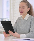 Person holding a 4x7 Inch Padded Bubble Mailers Pack Of 50 Self Seal Waterproof Black Poly Envelopes For Shipping And Packaging