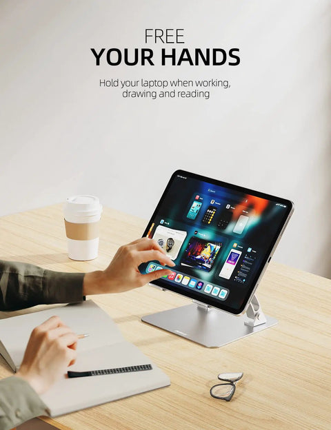 Ergonomic Adjustable Laptop Stand For Desk with Dual Foldable Riser and Heat Vent System, holding a laptop in a home office.