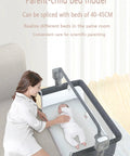 No Fuss Electric Bluetooth Bedside Crib For Babies, Co Sleeper Bassinet with soft mattress and parent beside baby.