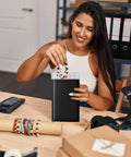 Woman packing jewelry in Black 100 Pack Padded Bubble Mailers 6x10 Inches Self Seal Envelopes for Shipping and Packing