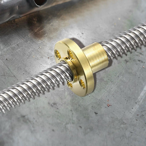 Top Shelf TR8x2 Lead Screw Brass Nuts on a threaded rod, showing smooth glide, designed for DIY 3D printers.
