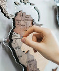 Heavy Duty Silver Thumb Tacks And Push Pins 50 Pack used to attach notes to a decorative map of South America.