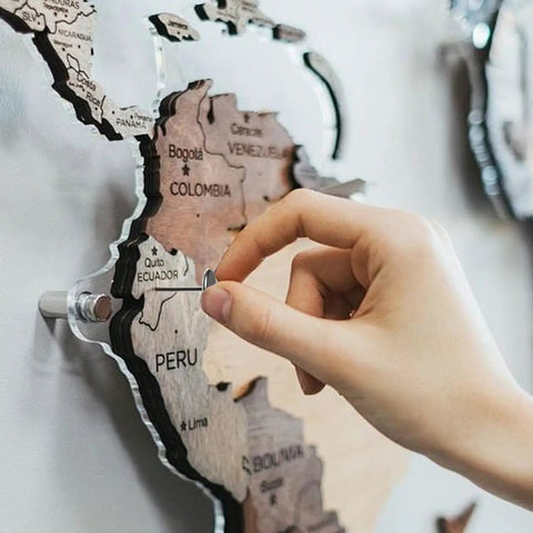 Heavy Duty Silver Thumb Tacks And Push Pins 50 Pack used to attach notes to a decorative map of South America.