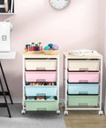 Rolling Storage Cart With Four Large Drawers And Wooden Top, Durable Powder-Coated Mobile Utility Cart On Wheels For Kitchen, Office, Garage, Or Craft Room Organization With Easy Access Storage, Rainbow Finish in a room setup