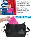 Person placing pink poncho from the 60 Pack Disposable Rain Ponchos For Adults With Hood, Emergency Waterproof Rain Gear into a bag.