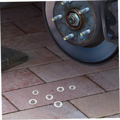 Stainless Steel Retaining Ring Assortment Kit With 30 Pieces Heavy Duty Snap Ring Sets displayed near automotive wheel on brick surface