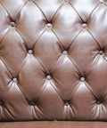 Kick Up Your DIY Game With Sleek Stainless Steel Upholstery Tacks Delivered Straight To Your Door With Top Shelf Decorative Furniture Nails Designed For Easy Sofa And Headboard Projects on a tufted leather headboard.