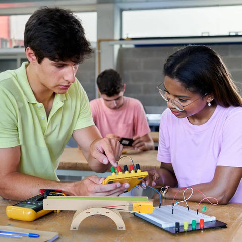 Students assembling DIY Electric Conveyor Belt Kit For Kids Hands On STEM Learning, 2 Piece Educational Model For Classroom Use.