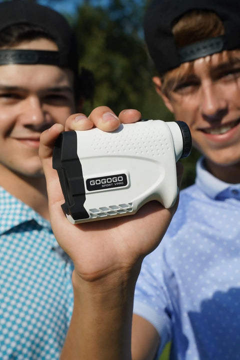 Person holding Bang For Your Buck Budget Friendly Golf And Hunting Rangefinder With Seven X Magnification, 1200 Yard Distance outdoors