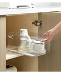 Rock Solid Heavy Duty Ball Bearing Drawer Slides Pair And Smooth As Silk Side Mount Tracks For Cabinets And Furniture With Cold Rolled Steel Full Extension Glide, showing a clear storage container being pulled from a cabinet.