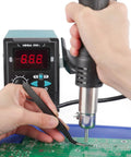 959D I Digital Hot Air Rework Station in use on a circuit board, showcasing precise PID temperature control and quick heat up.