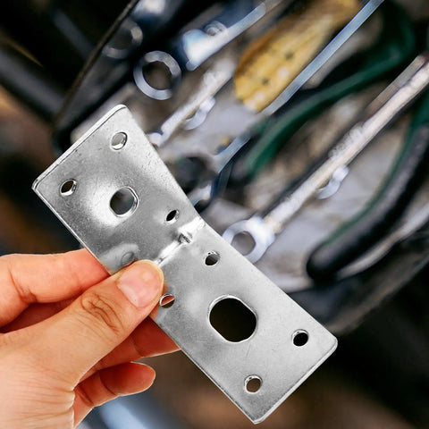 Close-up of Five Pack Iron L Shelf Brackets For 90 Degree Corners Heavy Duty Steel Corner Connectors, handheld view.