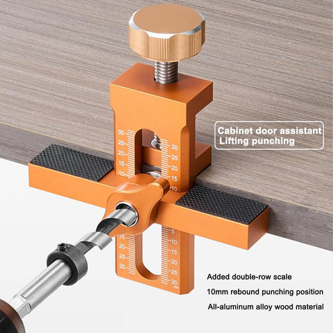2 In 1 Cabinet Door Installation Jig With Adjustable Positioner in use, made of orange aluminum alloy with dual 0 to 30 scales visible.
