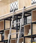 Stainless Steel Rolling Ladder Track Kit 10 Ft Floor To Ceiling Rail System with gliders on bookshelf for easy access.