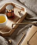 Antique Brass Cabinet Pulls 5 Inch Hole Centers 128mm Zinc Alloy Handles displayed with a wooden tray and a cup of tea