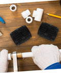 Two Piece Inner Outer Reamer Deburring Tool Set for Water Pipes on a wooden table with copper piping, gloves, and fittings