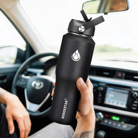 Built Tough 32 Oz Stainless Steel Water Bottle With Straw Cap And Wide Mouth Double Wall Vacuum Insulation Keeping drinks cool in car.