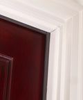 Close-up of brown primed hardwood and vinyl clad foam nail on top and sides door seal kit three piece set paintable weather stripping