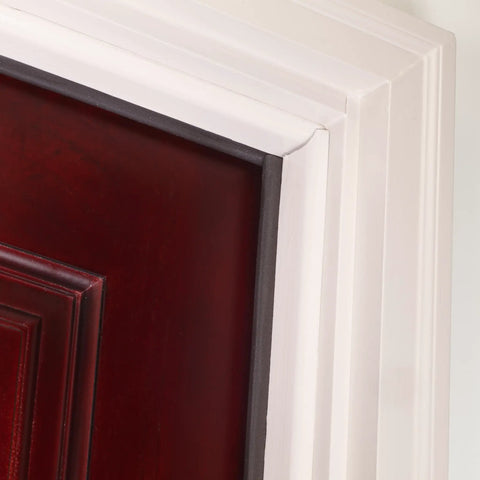 Close-up of brown primed hardwood and vinyl clad foam nail on top and sides door seal kit three piece set paintable weather stripping