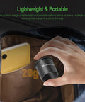 Hand placing C Mount To 1.25 Inch Barrel Adapter For Cams And Telescopes into bag, ideal for astrophotography, lightweight design.