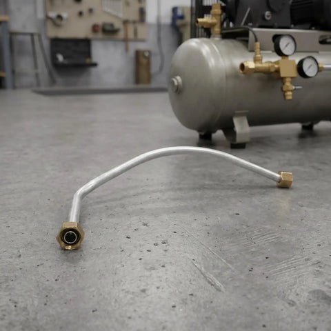 Slick 16mm Inner Diameter Air Compressor Hose Exhaust Tube With 11mm Stepped Outlet And Sturdy Hex Fittings on garage floor