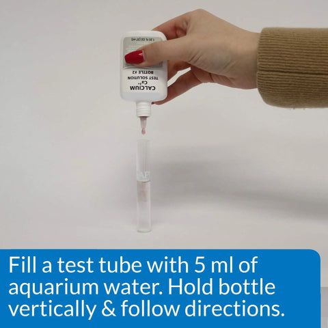 Freshwater Aquarium Test Kit Has 800 Tests For Ph Ammonia Nitrite And Nitrate To Maintain Safe Crystal Clear Water Protecting Fish From Harmful Spikes While Tracking Tank Stats On Point For Your Aquatic Squad Ensuring Legit Results Daily, filling a test tube with solution.