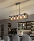 Five Light Farmhouse Kitchen Pendant Light in black industrial rectangular frame over island with clear glass shades, modern dining room