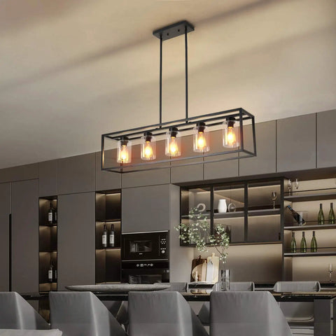 Five Light Farmhouse Kitchen Pendant Light in black industrial rectangular frame over island with clear glass shades, modern dining room
