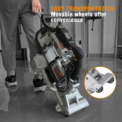 Person transporting Powerful 10 Amp Portable Band Saw With Lightweight Aluminum Base 5 Inch Deep Cut Variable Speed Handheld Automatic Cut Carrying Wheels Multipurpose Metal And Wood Cutter For Pro Metalworking And DIY Projects.