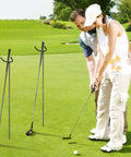 Two U Shaped Golf Club Holder Sets on the course with couple golfing, detachable metal stands for easy carry and visibility.