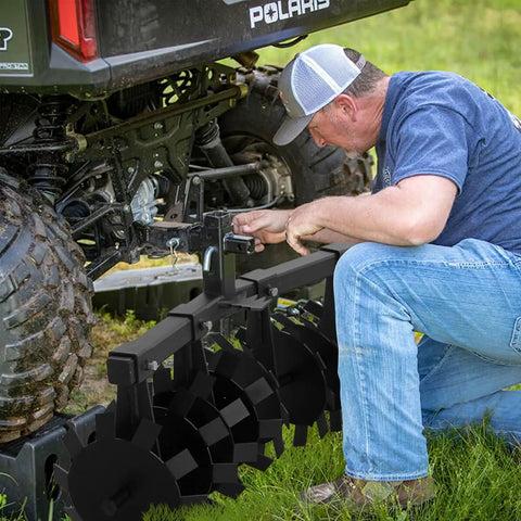 Beefy 34 Inch Disc Plow Harrow Heavy Duty With Adjustable Height And Wide Cut being attached to ATV with universal mount