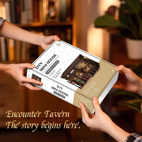 Two people holding a Cozy Corner Tavern Book Nook Kit With LED Lights For Adults DIY Miniature Dollhouse Puzzle In 3D Wood Craft box.