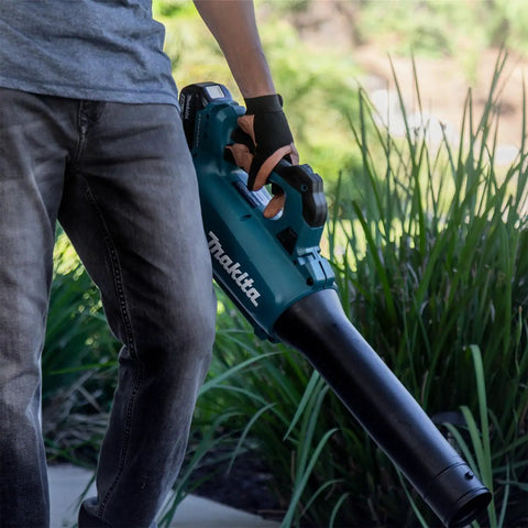 Renewed Brushless Cordless Leaf Blower held by user, showcasing ergonomic grip, designed for efficient yard work.