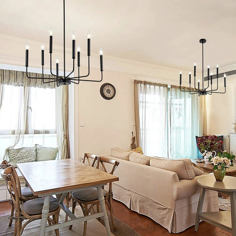 8-Light Modern Black Farmhouse Chandelier With Industrial Metal Arms And Candle-Style Cups in a cozy dining room setting.