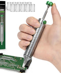 Person using Pro Grade 100W Soldering Gun Kit With LCD Temperature Display And Adjustable Heat on a circuit board