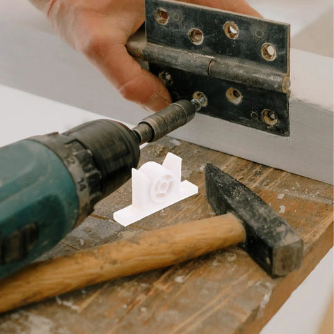 Installation of 10 Pack White ABS Cupboard Door Ball Catch Hardware With Double Roller using drill and hammer on wooden surface