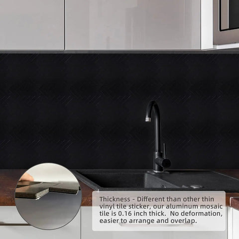 Black Herringbone Peel And Stick Kitchen Backsplash Tiles Kit Covering 14.64 Sq Ft Aluminum Composite Panels, 12 Sheets, installed above kitchen sink with thickness detail inset.