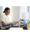 Woman typing wearing Carpal Tunnel Wrist Stabilizer For All Day Comfort And Support Adjustable Wrist Brace With Memory Foam Palm Comfy Fit